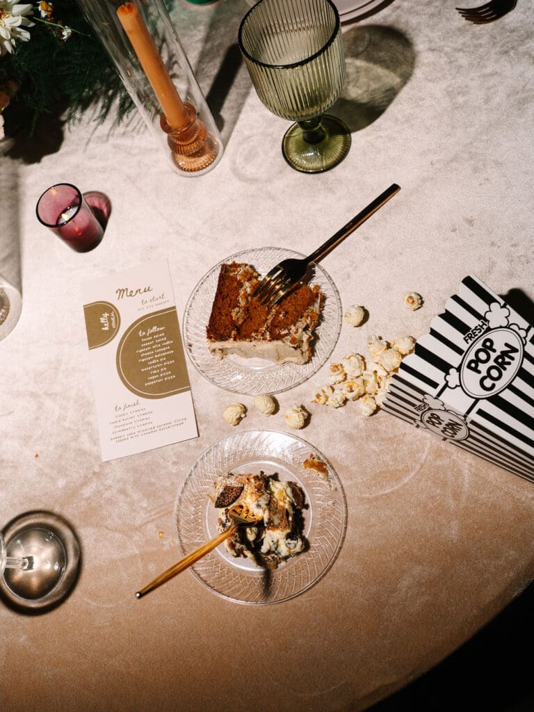 late night flat lay including cake and popcorn