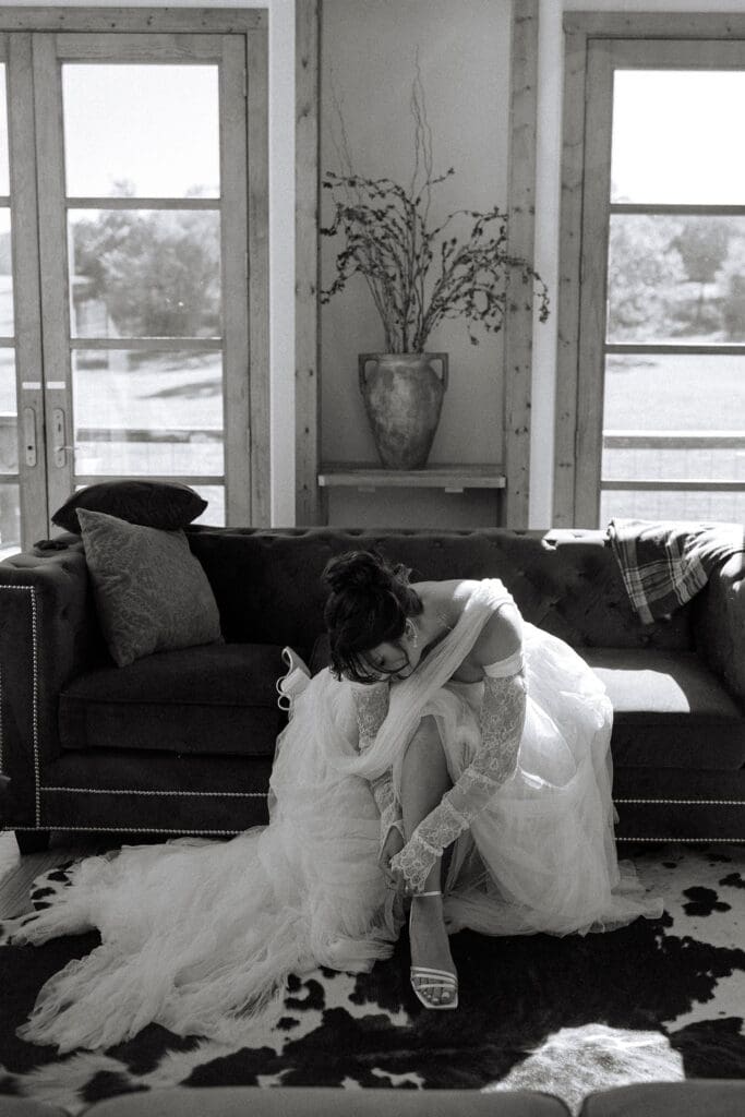 bride putting on her shoes at Sassafras Springs Vineyard and Winery