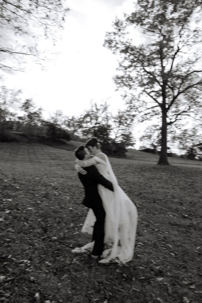 blurry photo of bride and groom twirling at Sassafras Springs Vineyard and Winery