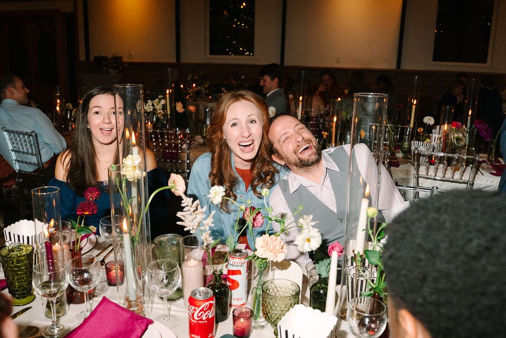 candid portrait of guests laughing during reception at Sassafras Springs Vineyard and Winery